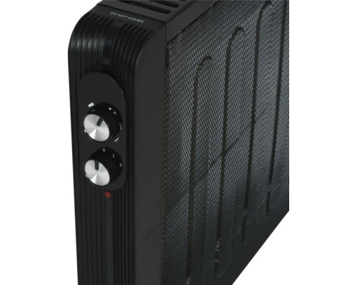 Detailweergave van een zwarte radiator met temperatuurregelaars