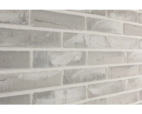ELABRICK Steenstrip Ibiza grijs wit Close-up van een muur met baksteenmotief