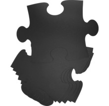 Zwarte puzzelstukjes in een stapel