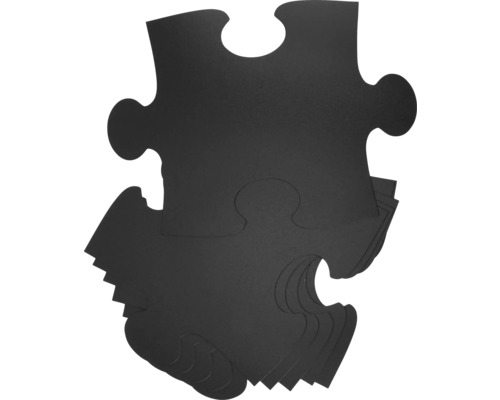 Zwarte puzzelstukjes in een stapel
