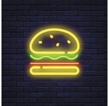 Neonreclame van een burger tegen een bakstenen muur
