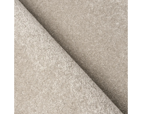 Close-up van een beige tapijt met zachte textuur