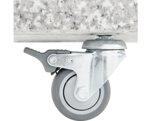 Zwenkwiel met rem op een stenen plaat