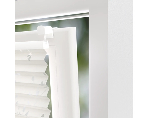 Detailaanzicht van een plisségordijn op een raam