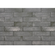Grijze steenstrips vormen een muur