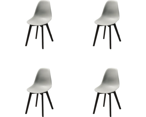 Vier stoelen met kunststof zitting en houten poten