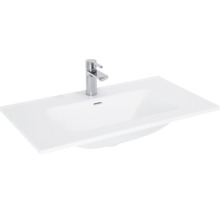 Wastafel van sanitair keramiek met kraan