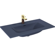 Wastafel van keramiek met kraan