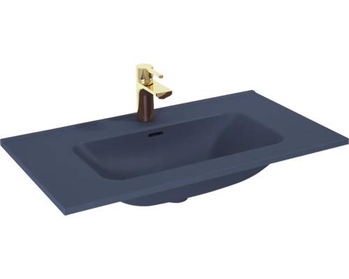 Wastafel van keramiek met kraan
