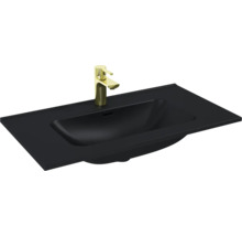 Zwarte wastafel met gouden kraan