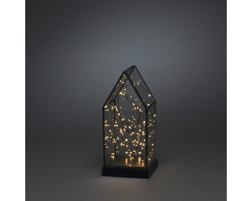 Decoratieve glazen lantaarn in de vorm van een huis met geïntegreerde verlichting