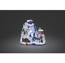Decoratief winterlandschap met huizen, skipistes en kerstbomen