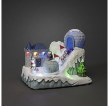 Decoratief winterlandschap met kasteel, iglo, pinguïns en verlichting