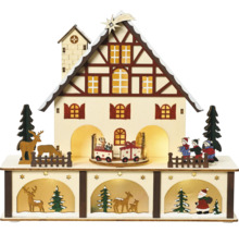 Decoratieve kersthuisverlichting met figuren en treinen