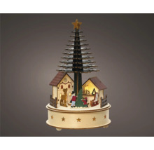 Kerstdecoratie met boom, huizen en figuren op een ronde basis