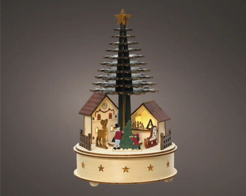 Kerstdecoratie met boom, huizen en figuren op een ronde basis