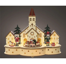 Decoratief kersttafereel met kerk, notenkrakers en trein