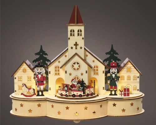 Decoratief kersttafereel met kerk, notenkrakers en trein
