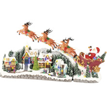 Kerstdorp decoratie met de kerstman in een slee en rendieren