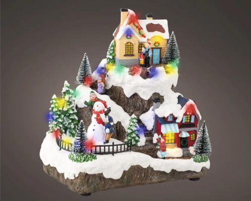 Decoratieve kerstscène met huizen, bomen, sneeuwpop en figuren