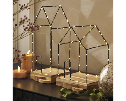 Decoratieve huizen met ledverlichting op houten voet
