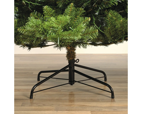 Detailopname van een kunstmatige kerstboom met metalen standaard