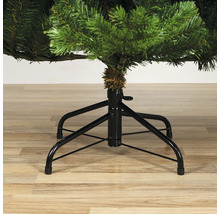 Detailopname van een kunstkerstboom met metalen voet.