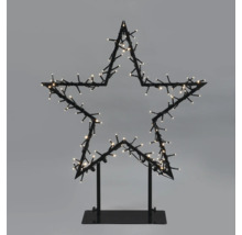 Decoratieve ster met verlichting op een voet