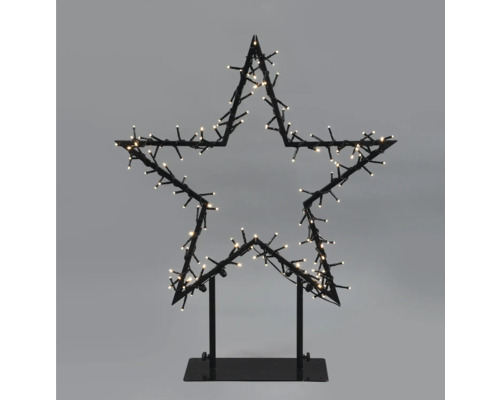 Decoratieve ster met verlichting op een voet