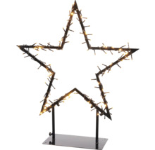 Stervormige kerstdecoratie met lichten op een standaard