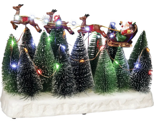 Decoratief kerstdorp met de kerstman in een slee, getrokken door rendieren, te midden van verlichte kerstbomen.