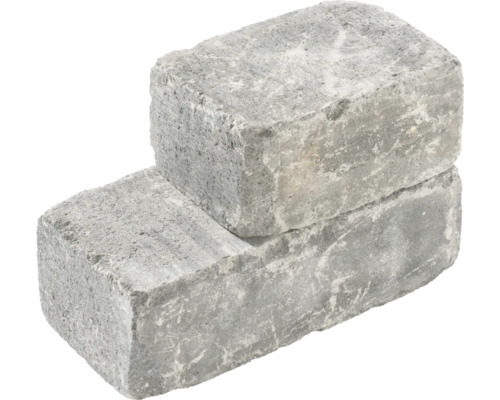 Twee grijze straatstenen gestapeld.