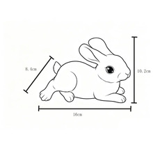 Lijntekening van een liggend konijn met afmetingen: 16 centimeter lengte, 10,2 centimeter hoogte en 8,4 centimeter breedte.